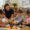 toddler daycare Roswell GA children playing with blocks in classroom with teacher supporting early learning activities